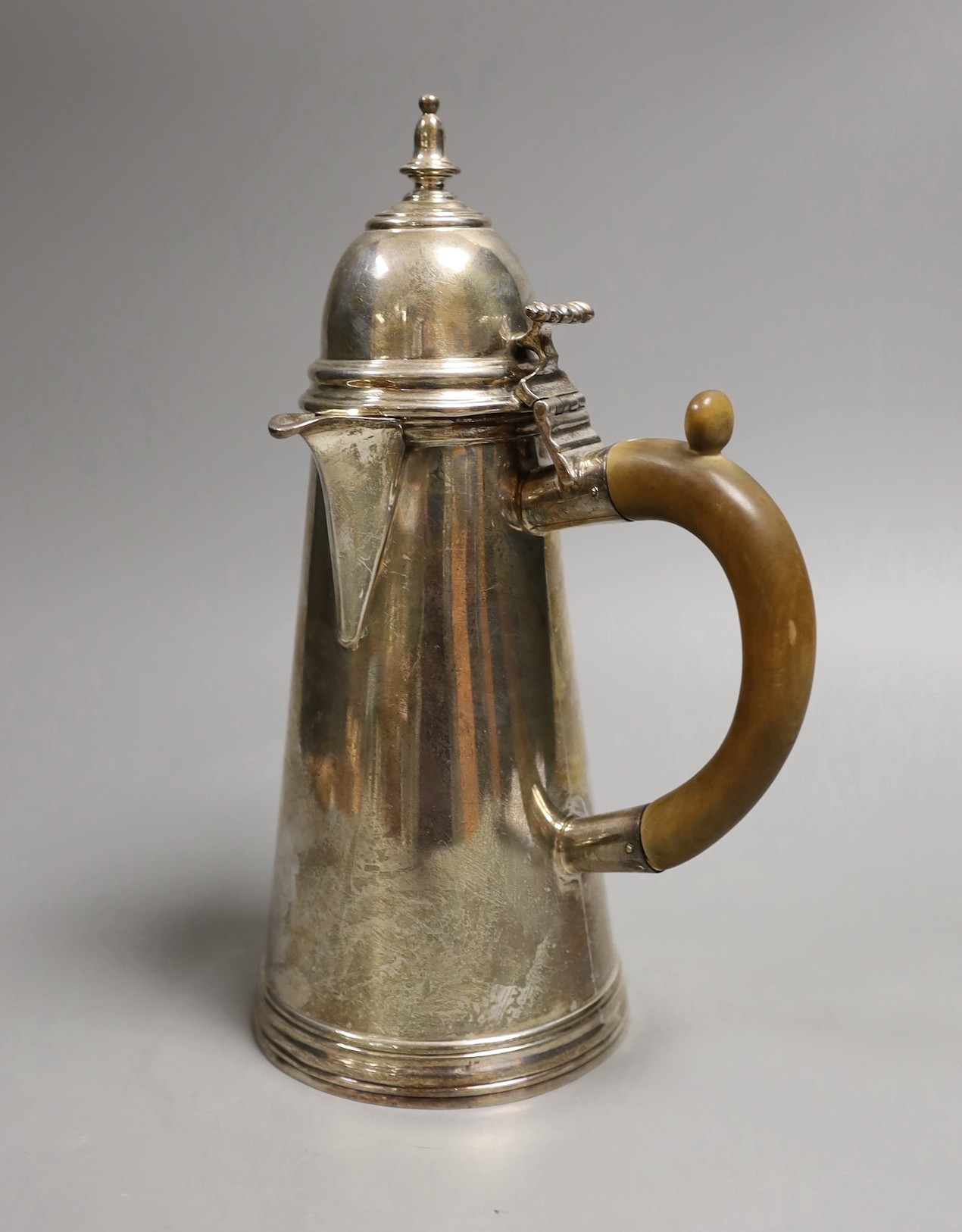 A George V Queen Ann style Brittania standard silver cafe au lait pot, Charles Stuart Harris & Sons, London, 1910, height 23.9cm, gross 19.9oz.
